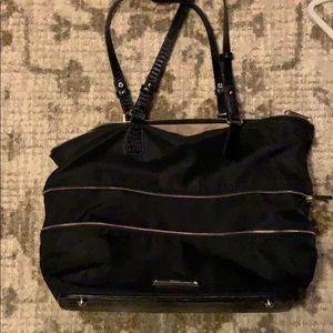 a zipping brahmin black tote